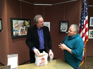 Rick Kearns, Harrisburg's poet laureate, speaks with an audience member Friday in city hall.