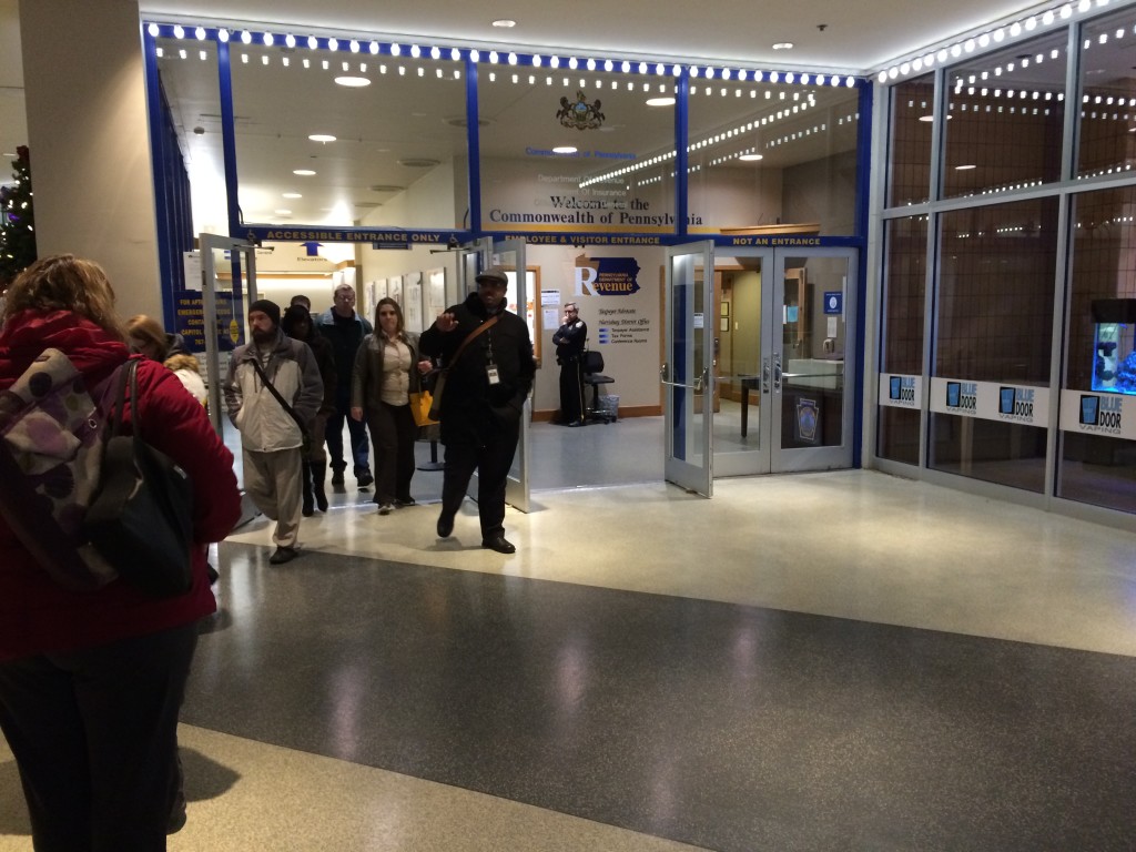 Workers leaving state offices Tuesday afternoon in downtown Harrisburg's Strawberry Square.