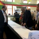 Mayor Eric Papenfuse and Andrew Duerr of Wallace Montgomery engineer firm review 3rd Street plans at yesterday's public meeting at the Broad Street Market.